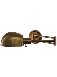 Addison Pharmacy-Style Adjustable Wall Lamp in Antique Brass.